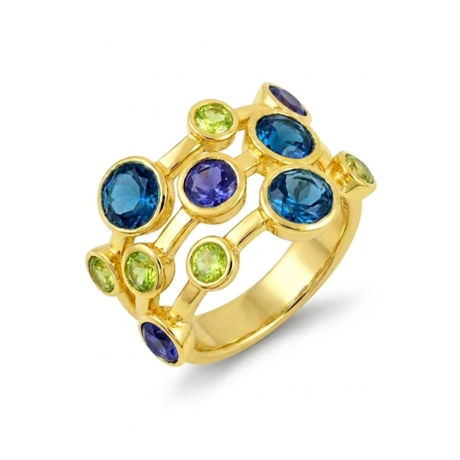 Gold ring with blue and green gemstones on a white background