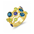 Gold ring with blue and green gemstones on a white background